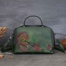 Vintage Cowhide Pillow Bag With Embossed Detailing And A Handheld Design
