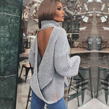 Pile up loose sweaters with crossed necks and halter backs