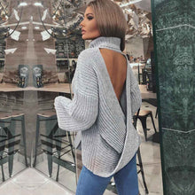 Pile up loose sweaters with crossed necks and halter backs