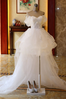 The Bride'S Wedding Dress With Long Tail In Front Of The Studio by Mirlaine Univers