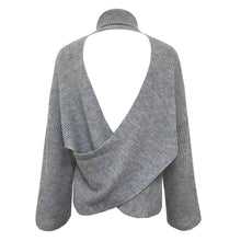 Pile up loose sweaters with crossed necks and halter backs