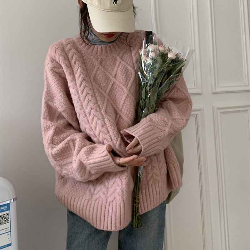 Women Wearing Loose Sweaters Outside The Street With Gentle Wind