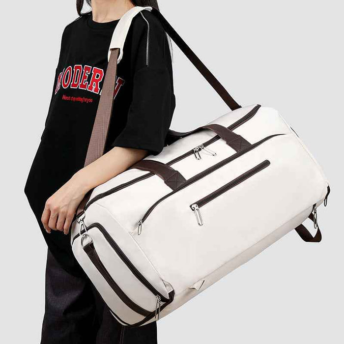 Sac fourre-tout sport et voyage polyvalentSac bandoulière avec séparation sec-humide et design multifonctionnel pour le fitness