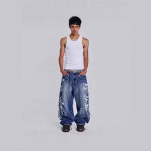 Womens Distressed Relaxed-Fit Denim Jeans With A Bold Totem Print And Extra-Wide Legs