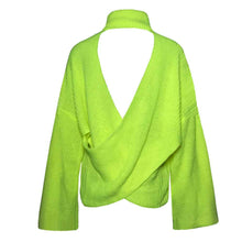 Pile up loose sweaters with crossed necks and halter backs