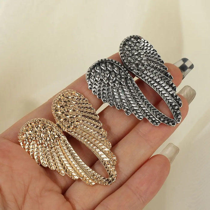 Bague vintage en métal en forme d'ailes d'ange avec grand cœur, style punk hip-hop, bijou cadeau pour hommes et femmes