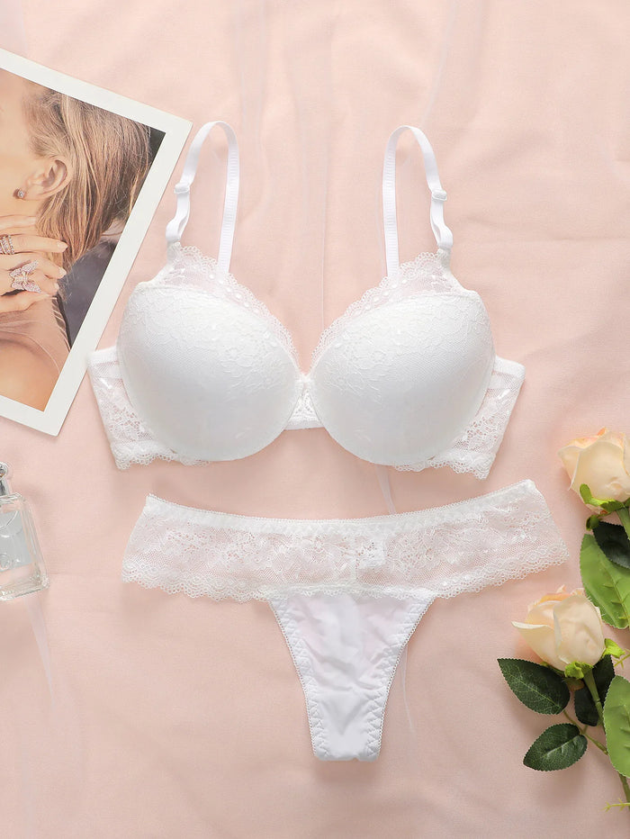 Hot selling women's sexy embroidered lace bra set with steel ring gathering push up and seamless thong set B6064