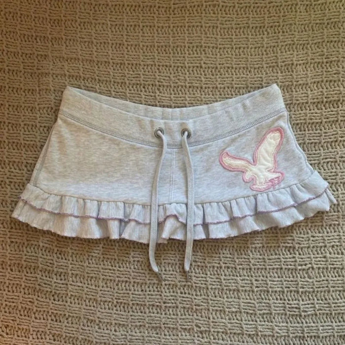 Mini-jupe à imprimé lettres style Y2K pour femmes, jupe Harajuku à cordon de serrage, style mignon et décontracté, streetwear, jupe grunge à volants, mode chic