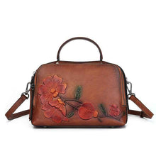 Vintage Cowhide Pillow Bag With Embossed Detailing And A Handheld Design