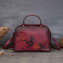 Vintage Cowhide Pillow Bag With Embossed Detailing And A Handheld Design