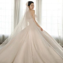 A Strapless Dress With A Big Train by Mirlaine Univers