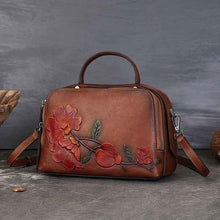 Vintage Cowhide Pillow Bag With Embossed Detailing And A Handheld Design