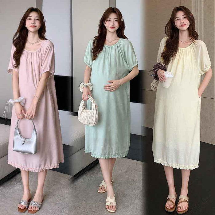 Robe midi en mousseline de style doux et rajeunissant avec poches